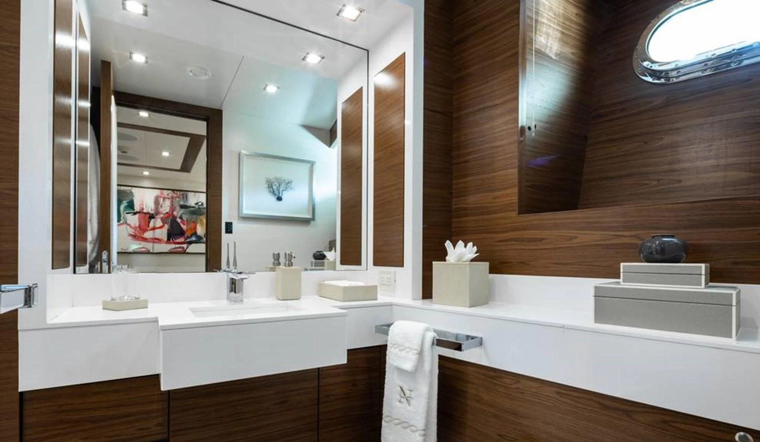 The yacht's bathroom features modern fixtures and elegant wood paneling. aboard NORTHLAND Yacht for Sale