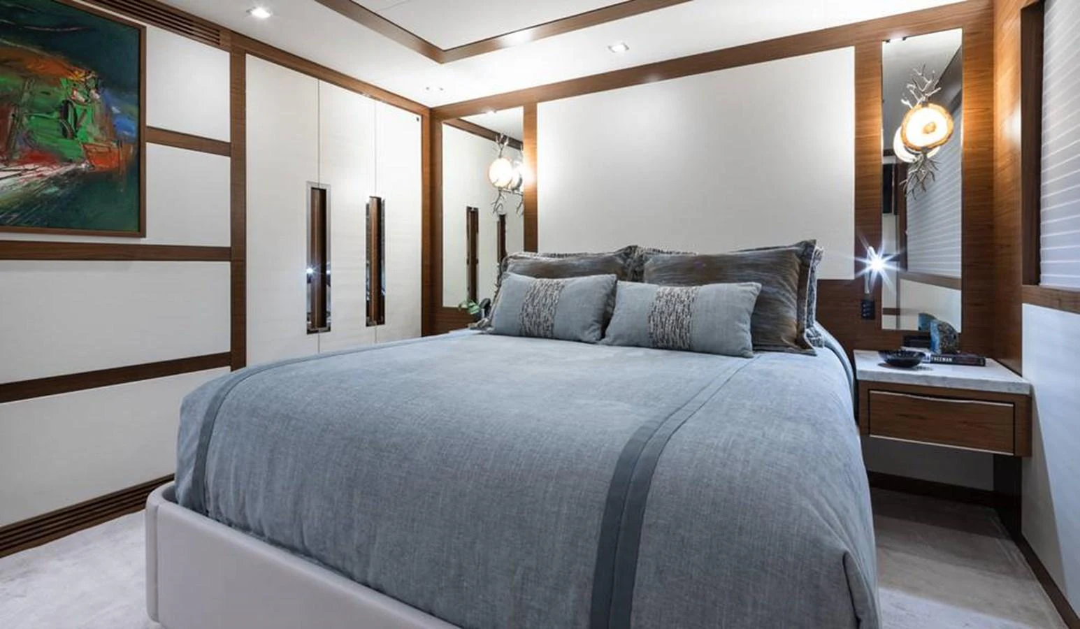 The stateroom features a plush bed with elegant bedding and modern decor. aboard NORTHLAND Yacht for Sale
