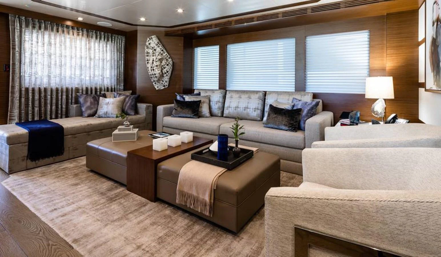 The salon features plush seating, elegant decor, and ample natural light for a comfortable and stylish ambiance. aboard NORTHLAND Yacht for Sale