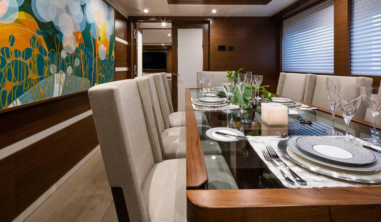 The yacht's dining area features a sophisticated setting with a large table and elegant decor. aboard NORTHLAND Yacht for Sale
