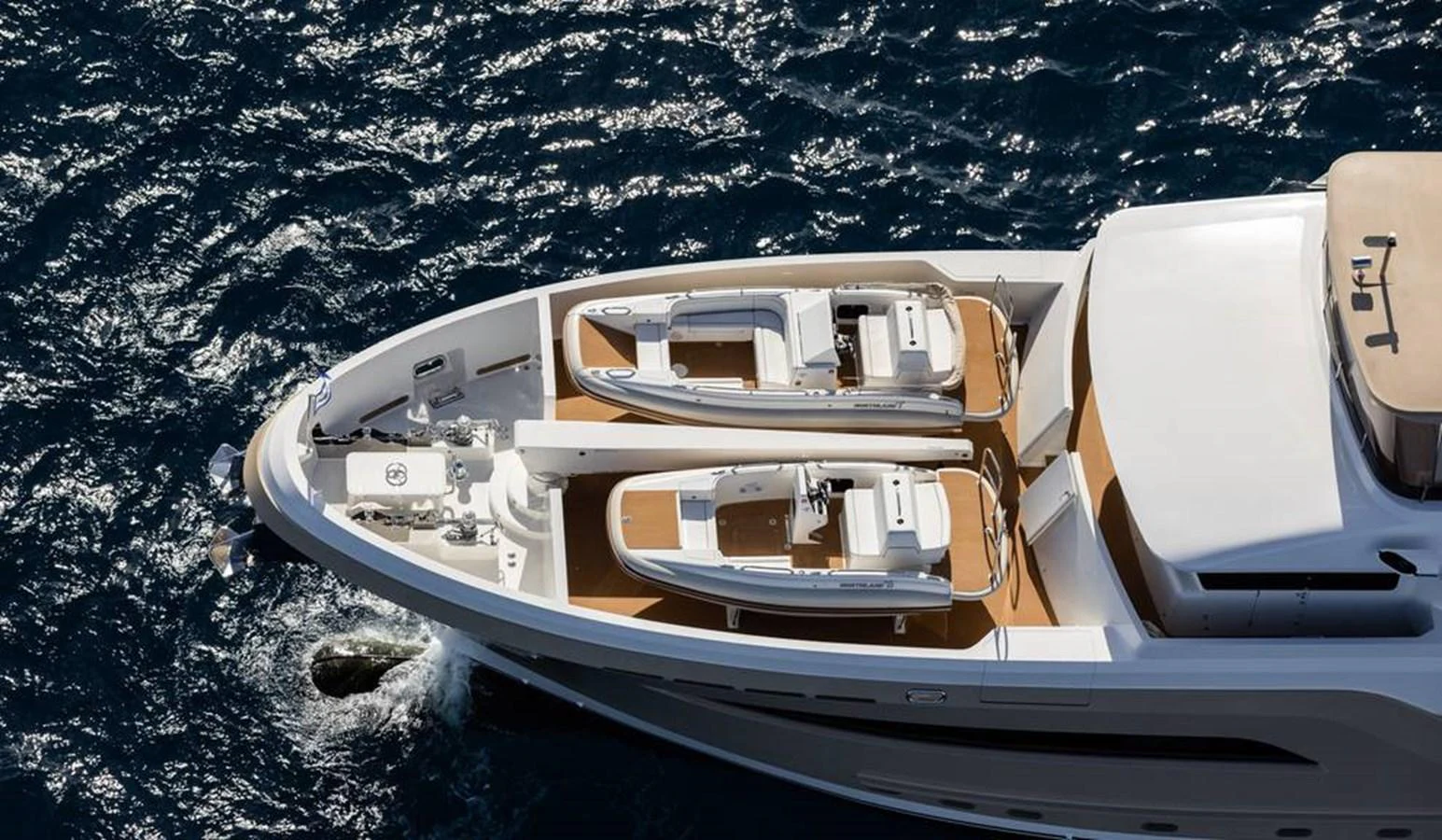 The yacht's foredeck features two sleek tenders ready for deployment. aboard NORTHLAND Yacht for Sale