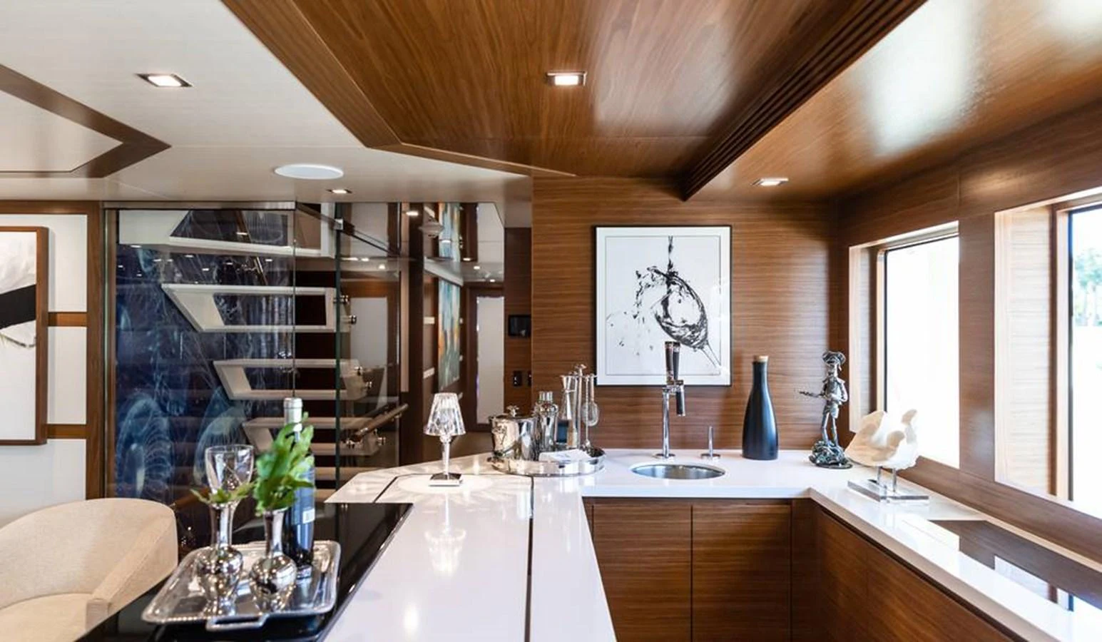 The yacht's interior features a modern and elegant bar area with sleek design elements. aboard NORTHLAND Yacht for Sale