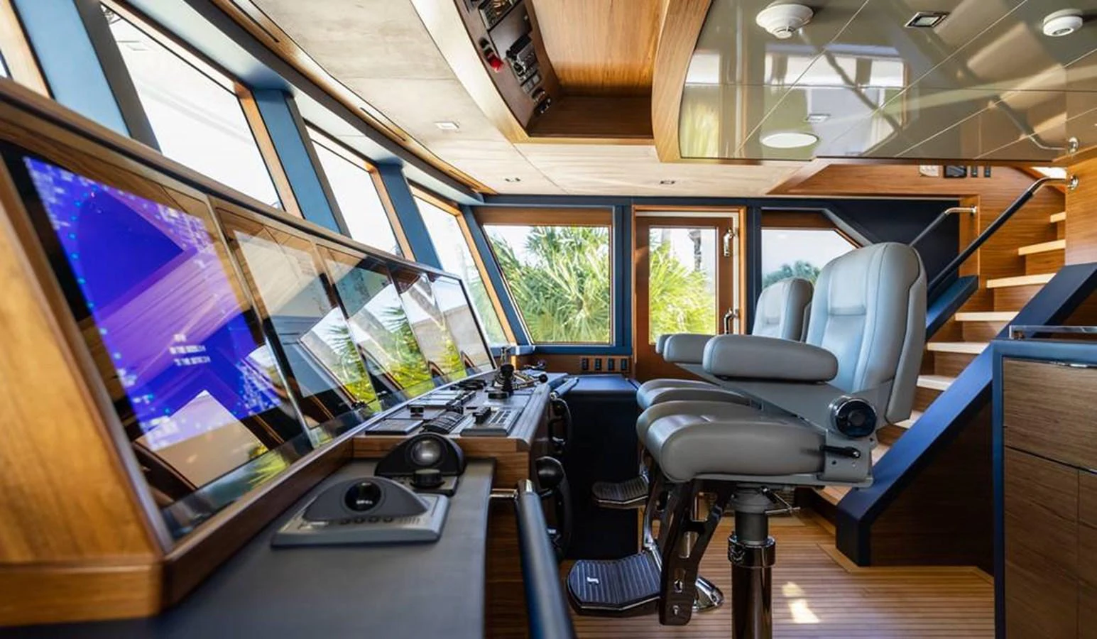 The helm station features state-of-the-art navigation equipment and luxurious seating. aboard NORTHLAND Yacht for Sale