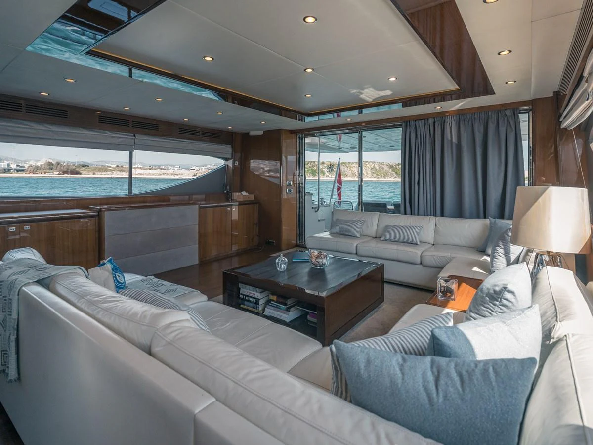 The yacht's salon features plush seating and expansive windows offering panoramic views. aboard 4 LIFE Yacht for Sale