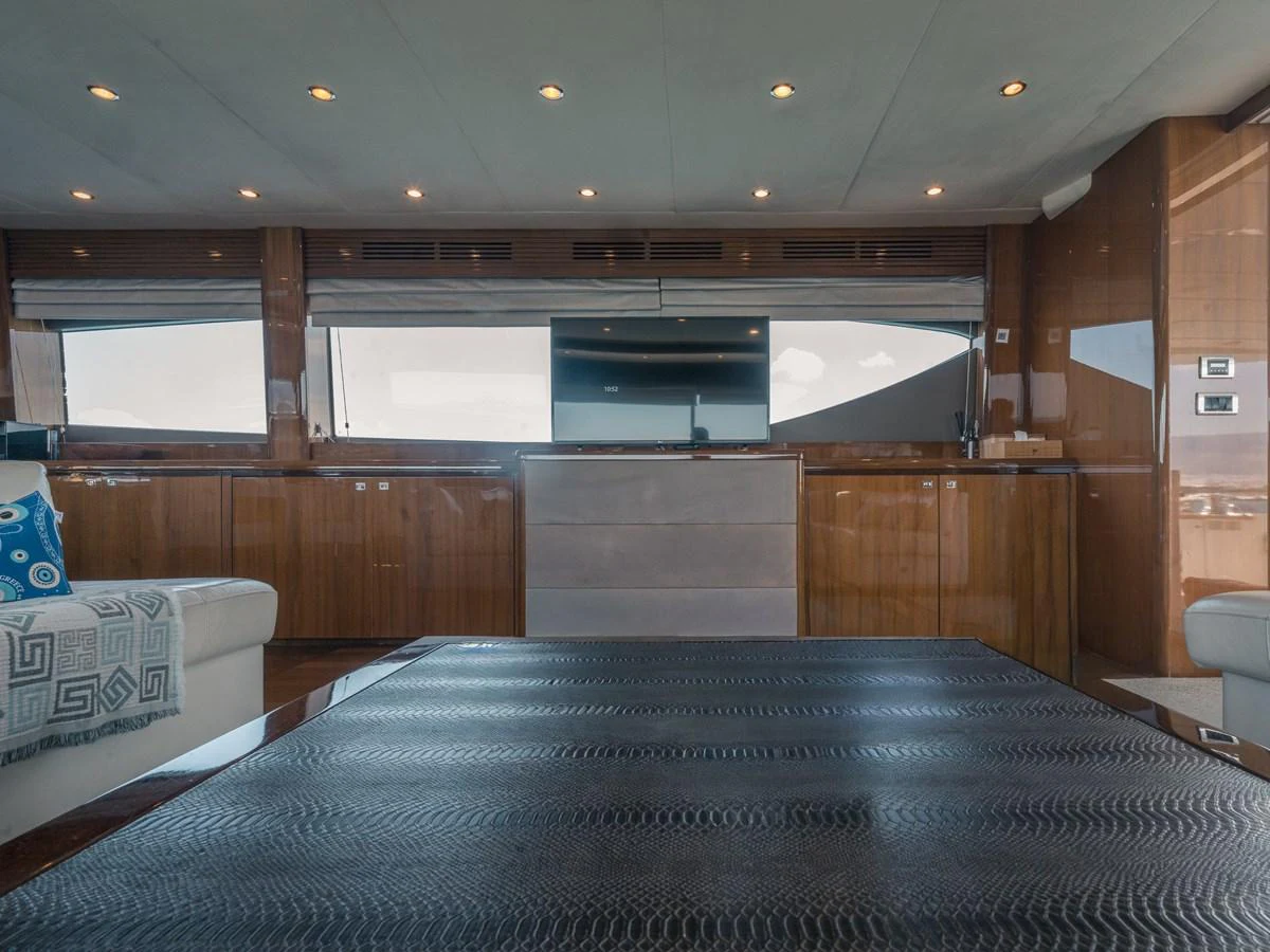 The yacht's interior features a sleek and modern design with polished wood finishes and ample natural light. aboard 4 LIFE Yacht for Sale