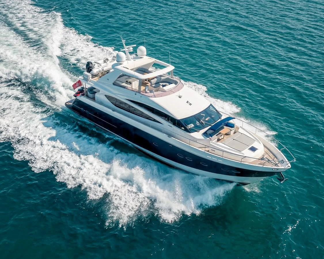 A sleek and modern yacht cruises swiftly through the open water. aboard 4 LIFE Yacht for Sale