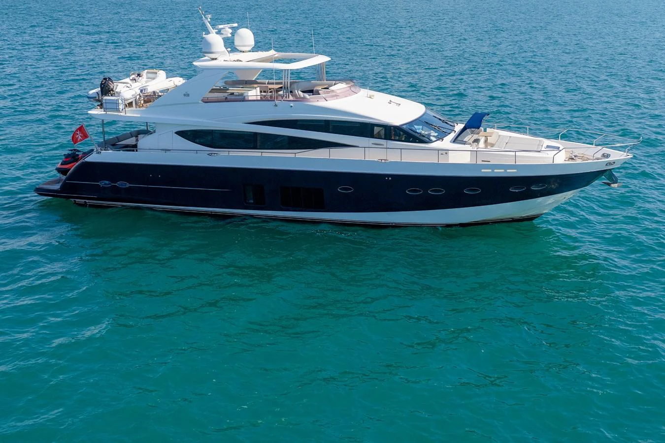 A sleek and modern yacht cruising on clear blue waters. aboard 4 LIFE Yacht for Sale