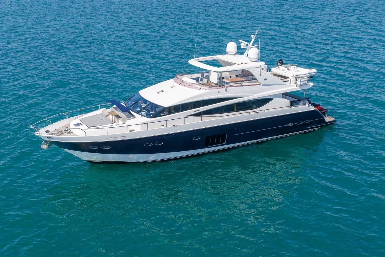 A sleek and modern yacht cruising on clear blue waters. aboard 4 LIFE Yacht for Sale
