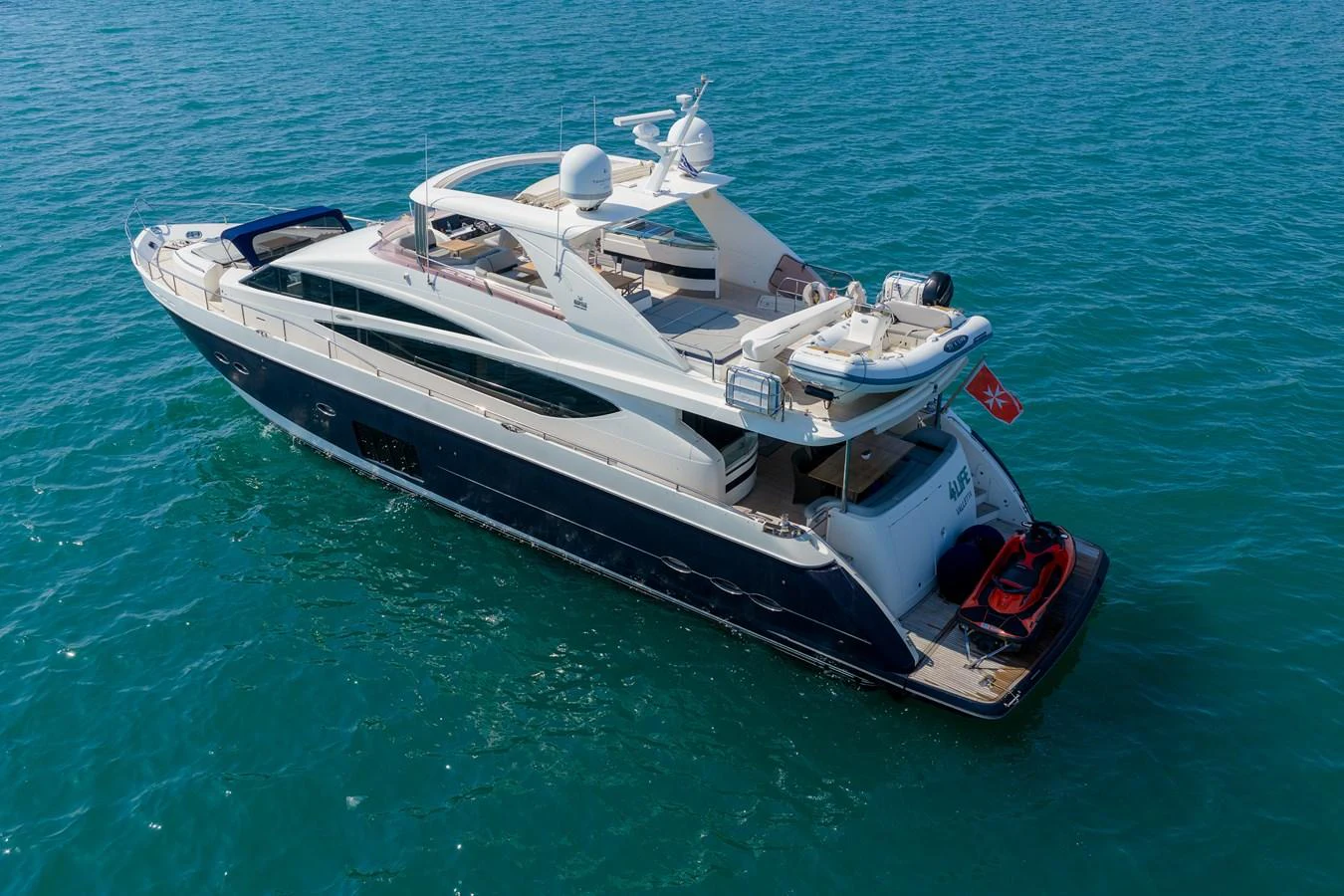 A sleek and modern yacht cruising on calm blue waters. aboard 4 LIFE Yacht for Sale