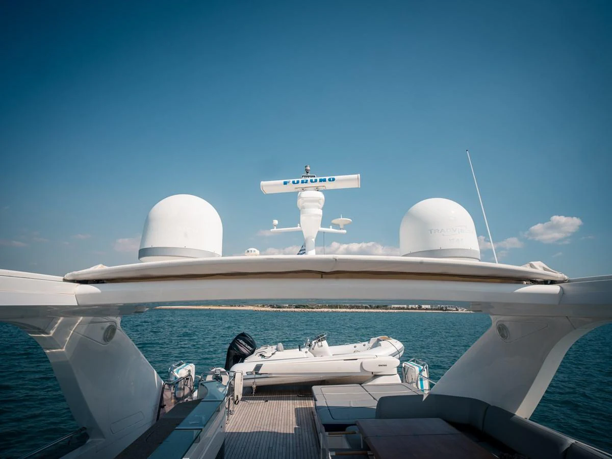 The yacht's aft deck showcases a spacious and inviting area with a tender and clear views of the surrounding waters. aboard 4 LIFE Yacht for Sale