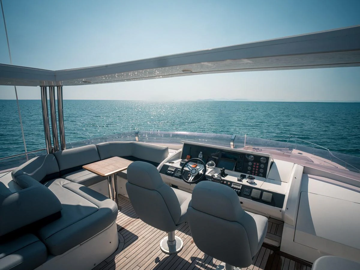 The yacht's helm offers a panoramic view of the open sea, complemented by comfortable seating and modern navigation equipment. aboard 4 LIFE Yacht for Sale