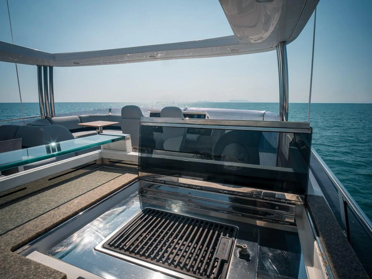 An outdoor grill area on a yacht with a stunning ocean backdrop. aboard 4 LIFE Yacht for Sale