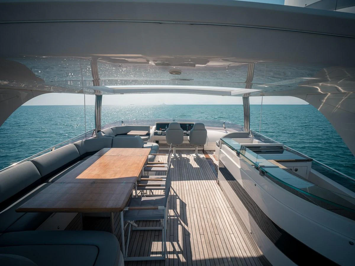 The aft deck of this yacht offers a spacious and luxurious outdoor living area with stunning ocean views. aboard 4 LIFE Yacht for Sale