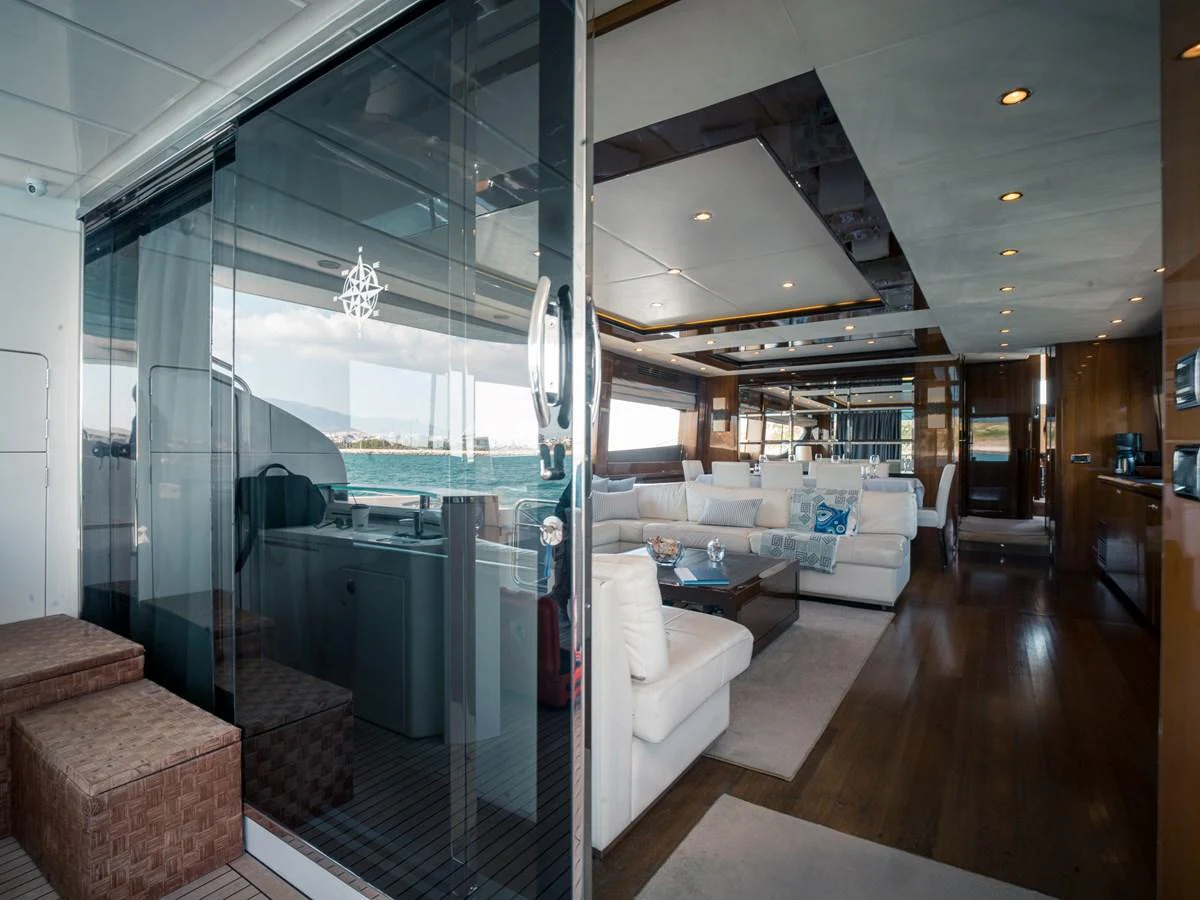 The yacht's salon features luxurious seating and elegant decor with ample natural light. aboard 4 LIFE Yacht for Sale