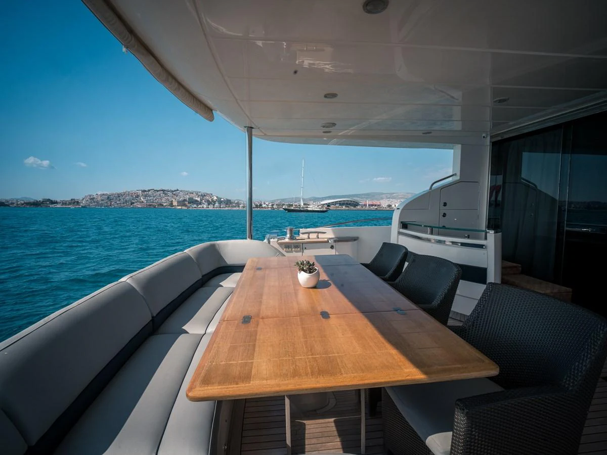 The aft deck offers a spacious and inviting area for alfresco dining with stunning views of the water. aboard 4 LIFE Yacht for Sale