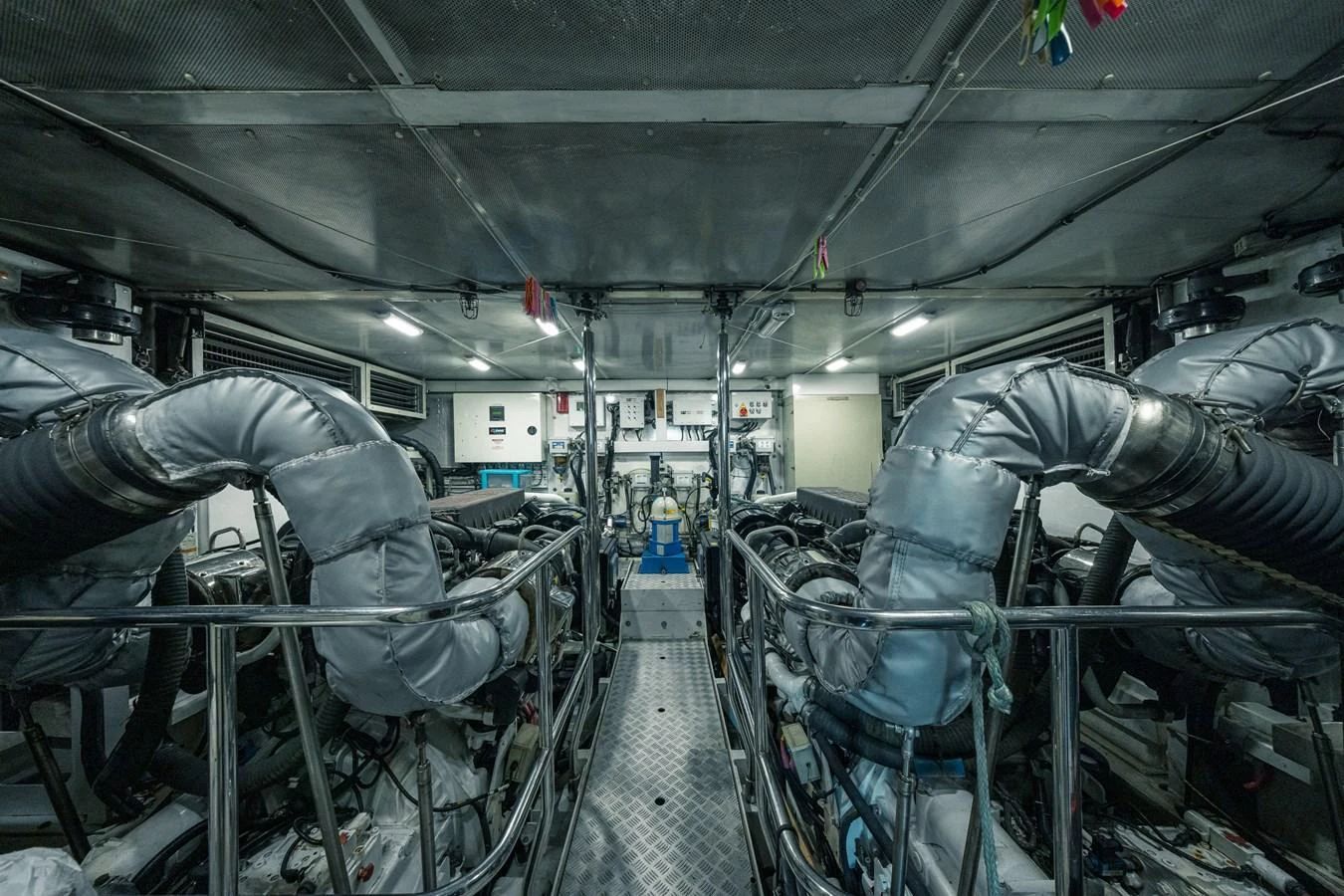 The image showcases the yacht's meticulously organized engine room with advanced machinery and equipment. aboard 4 LIFE Yacht for Sale