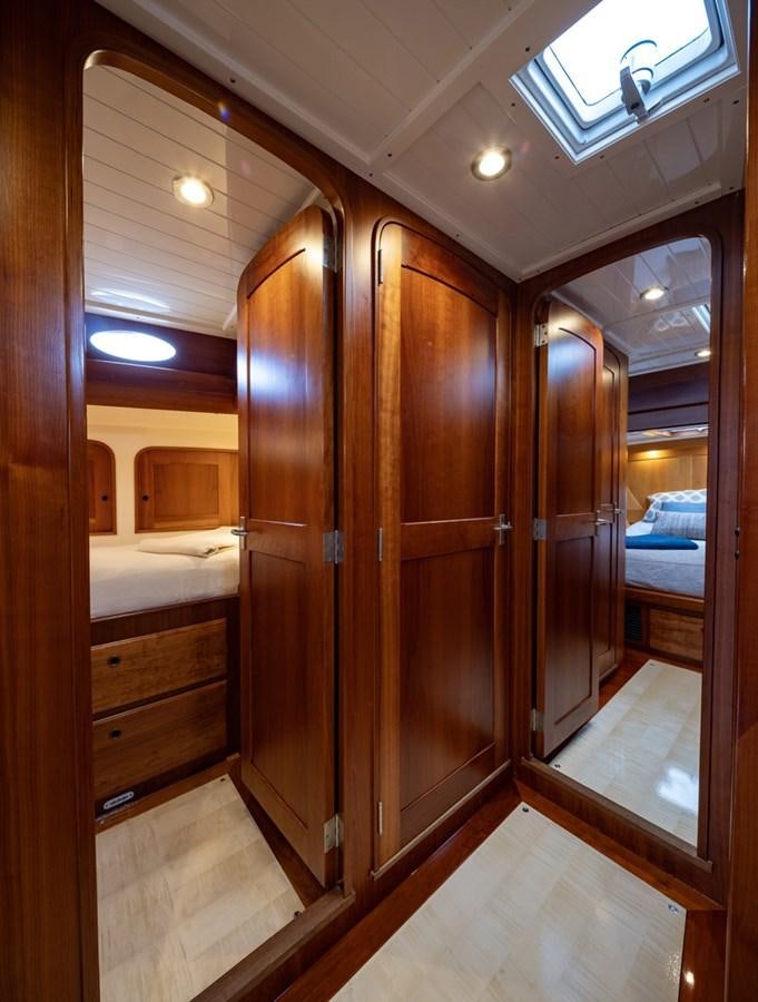 a room with a wood door and a mirror aboard PRIVATE Yacht for Sale
