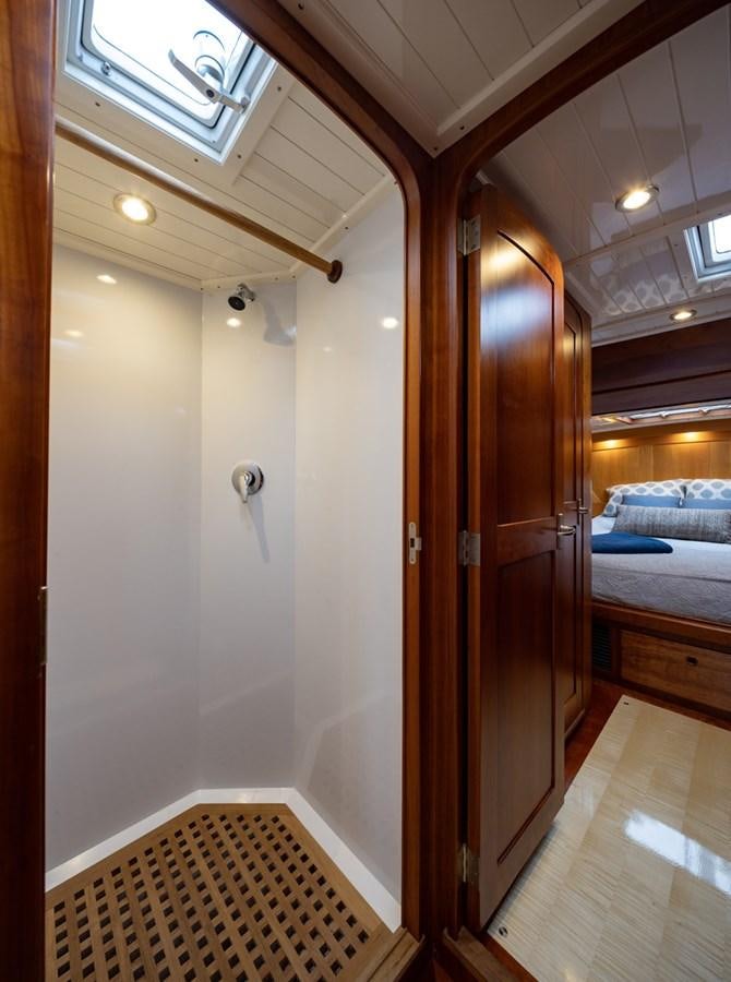 a room with a bed and a door aboard PRIVATE Yacht for Sale
