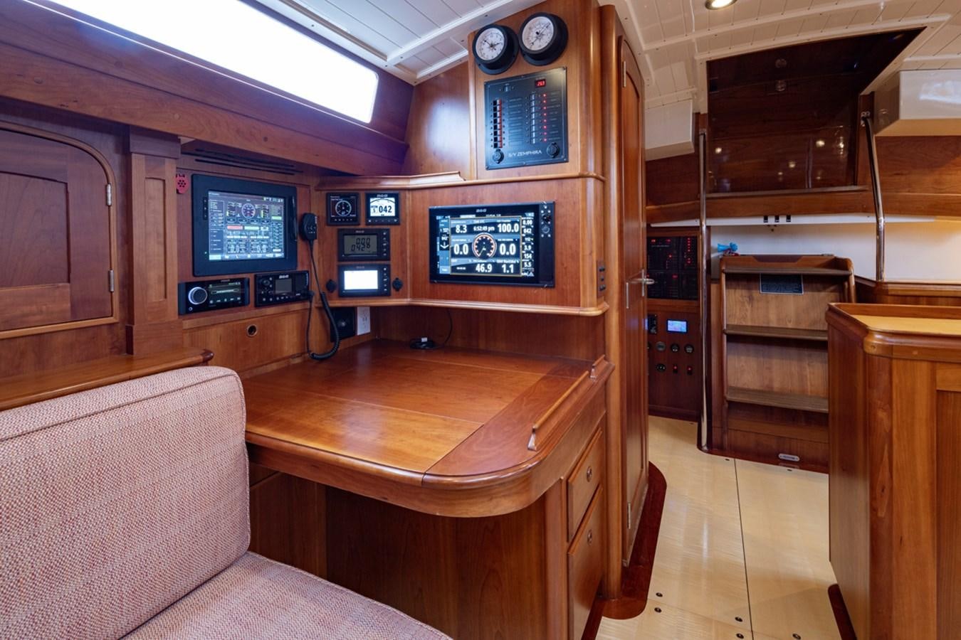 a room with a table and tv aboard PRIVATE Yacht for Sale