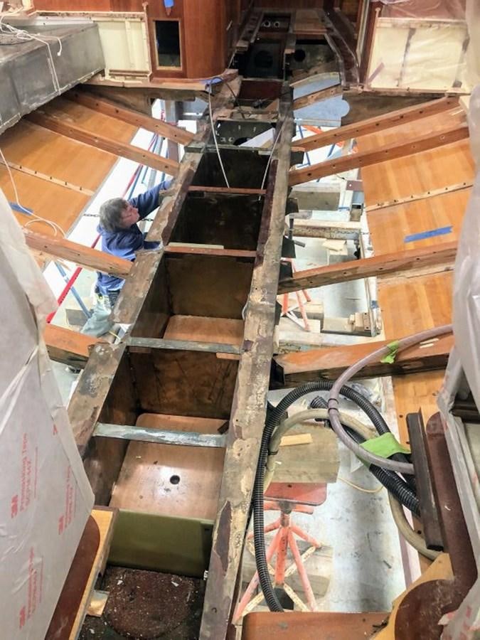 a group of people working on a large machine aboard PRIVATE Yacht for Sale