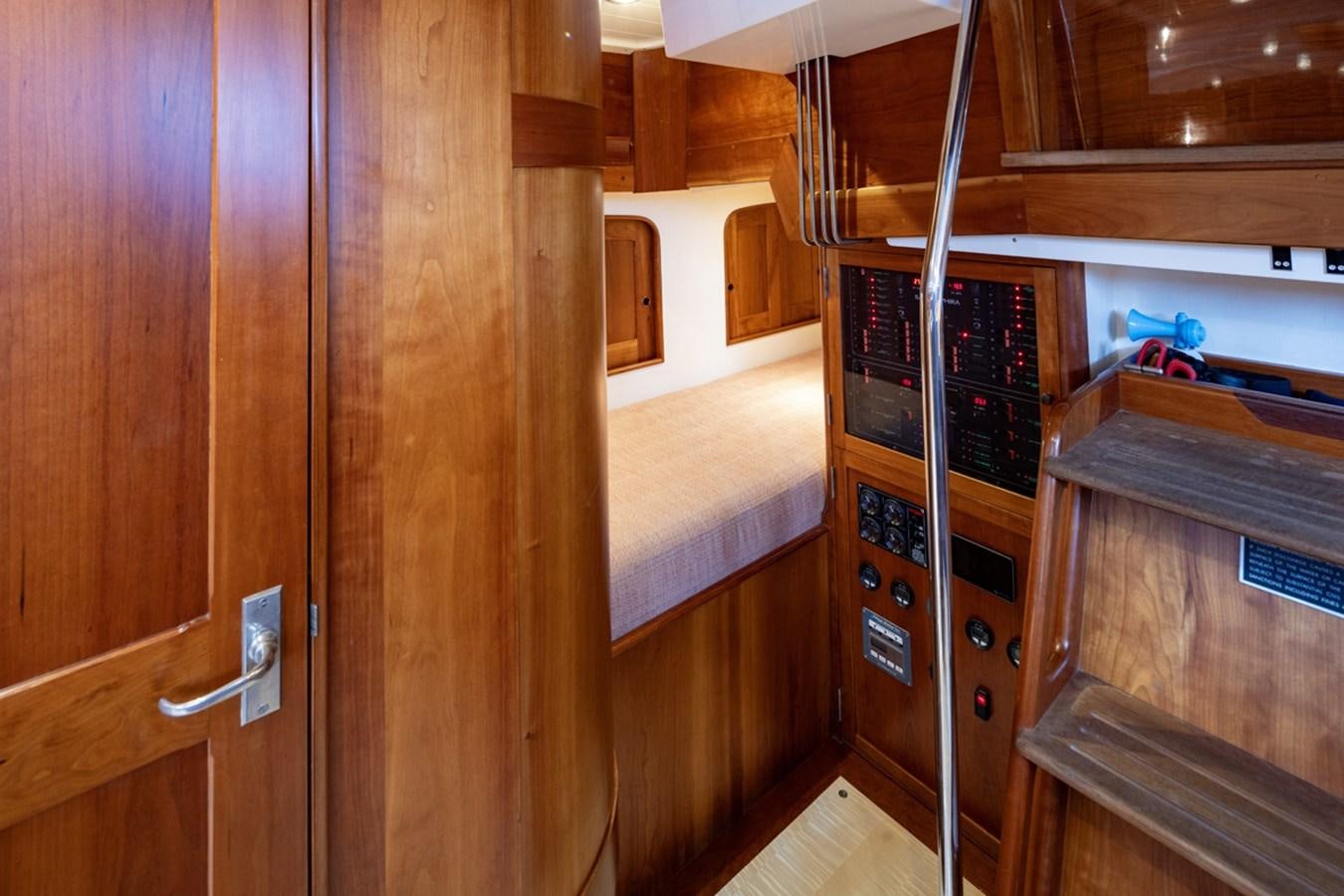 a wooden cabinet with a shelf aboard PRIVATE Yacht for Sale