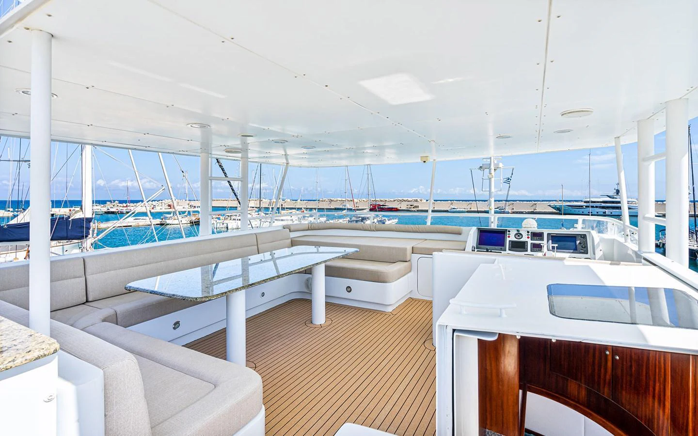 The flybridge offers a spacious seating area with panoramic views of the marina. aboard MISS SARAH J Yacht for Sale