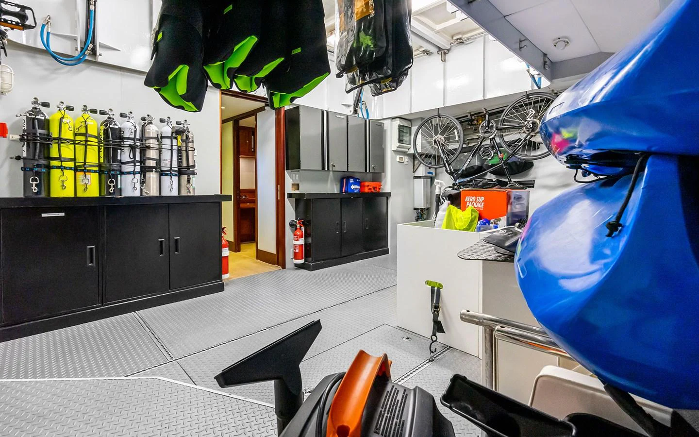 The yacht's storage room is well-organized, featuring equipment for diving and biking. aboard MISS SARAH J Yacht for Sale