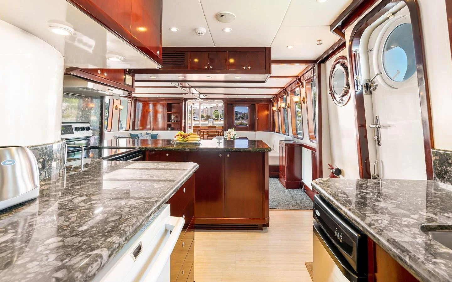 The galley features luxurious finishes with ample counter space and modern appliances. aboard MISS SARAH J Yacht for Sale
