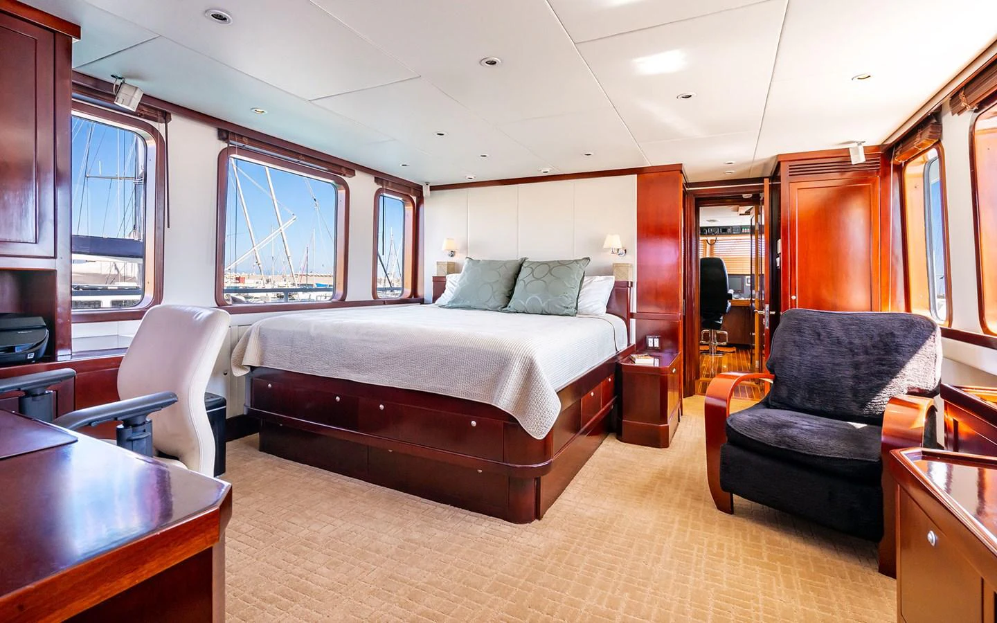 The master stateroom offers a spacious and luxurious retreat with elegant wood finishes and ample natural light. aboard MISS SARAH J Yacht for Sale
