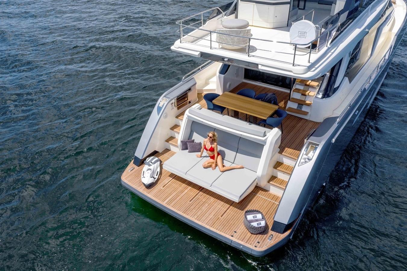 two people sitting on a boat aboard LFS Yacht for Sale
