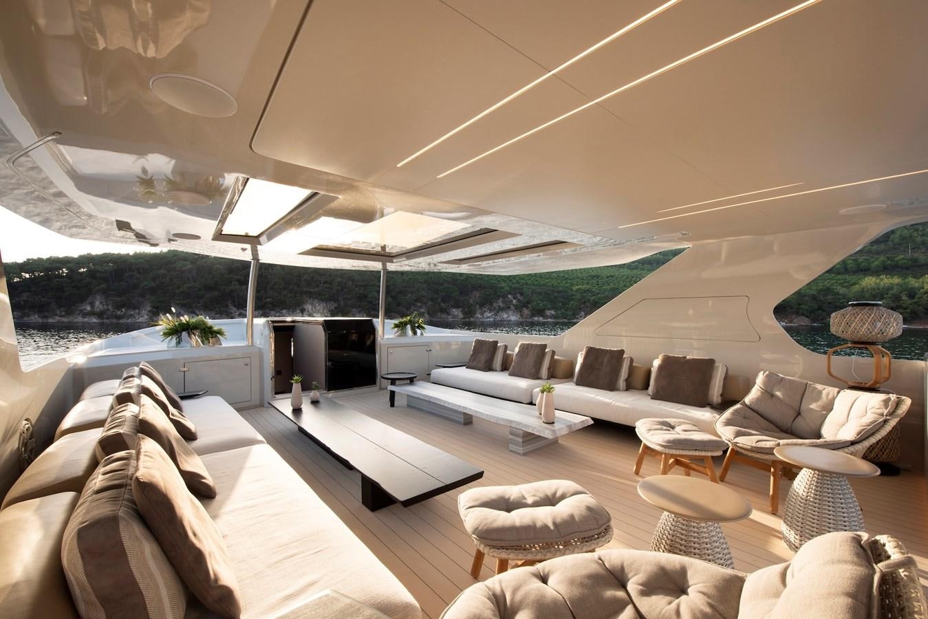 a room with a large lounge area aboard MAZU 82 Yacht for Sale