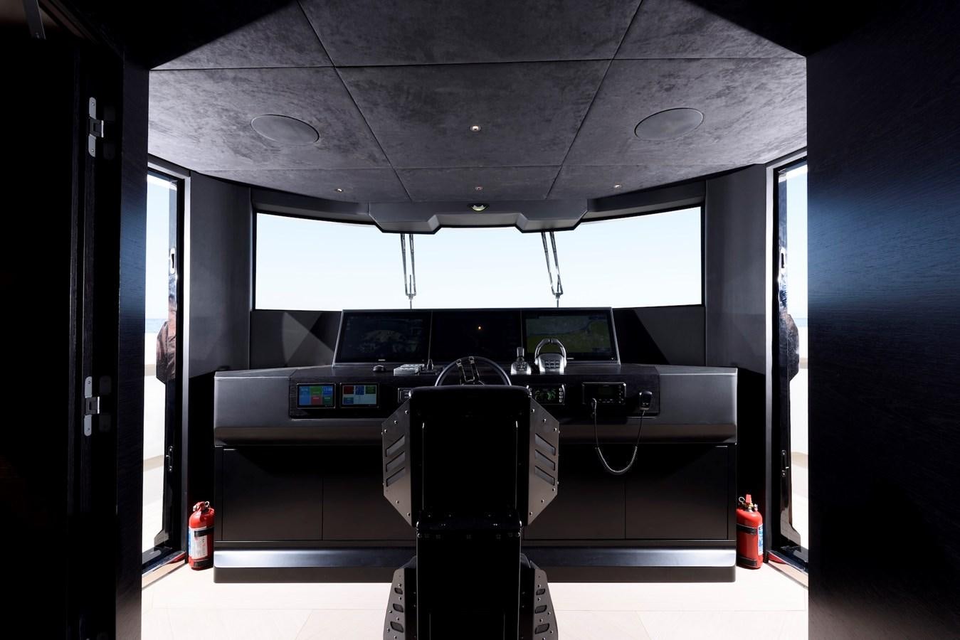 a black machine in a room aboard MAZU 82 Yacht for Sale