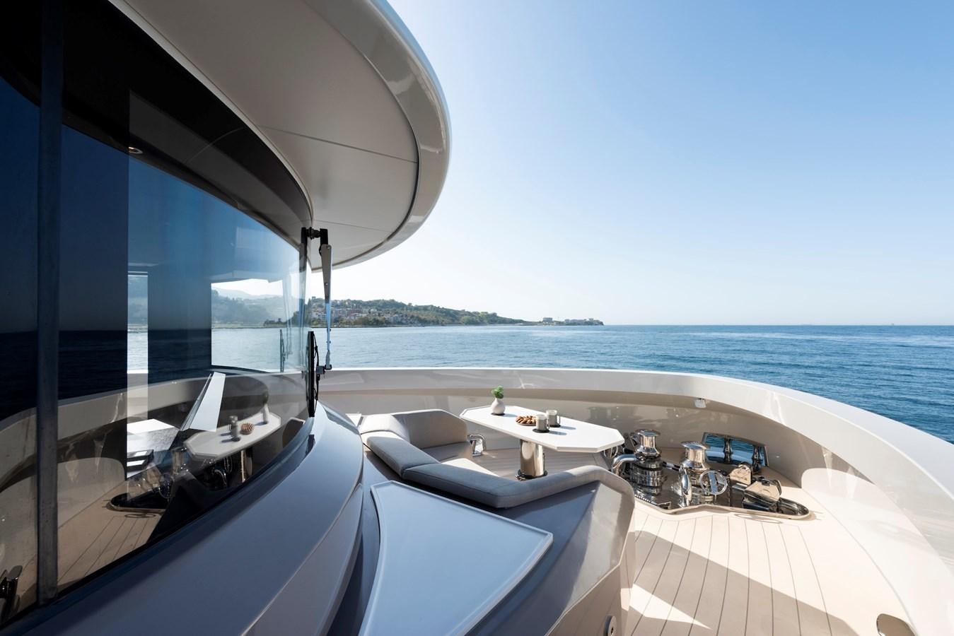 a large white boat with a large window overlooking a body of water aboard MAZU 82 Yacht for Sale