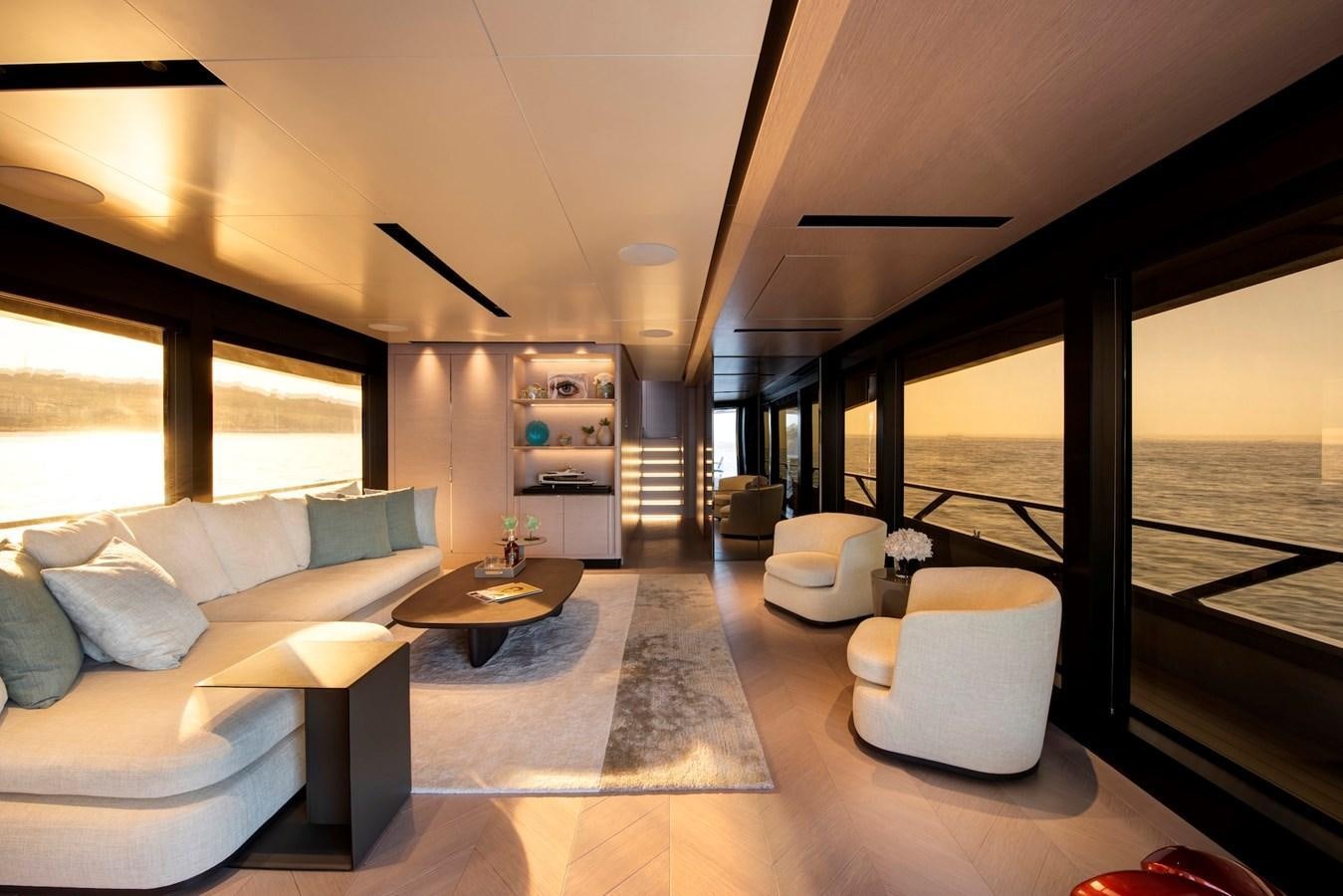 a living room with a large window aboard MAZU 82 Yacht for Sale