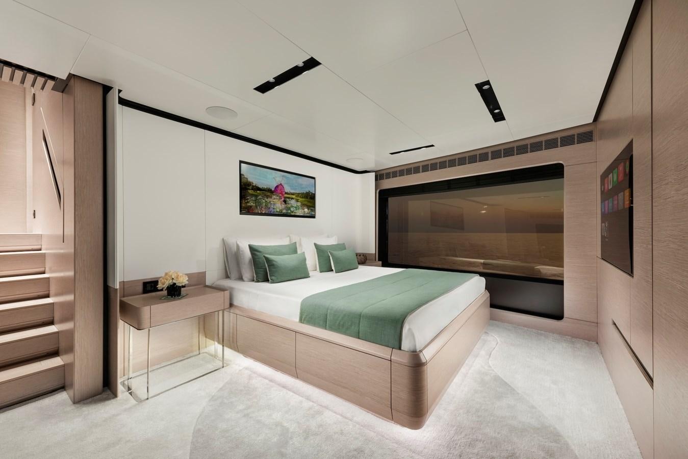a bedroom with a bed and a tv aboard MAZU 82 Yacht for Sale