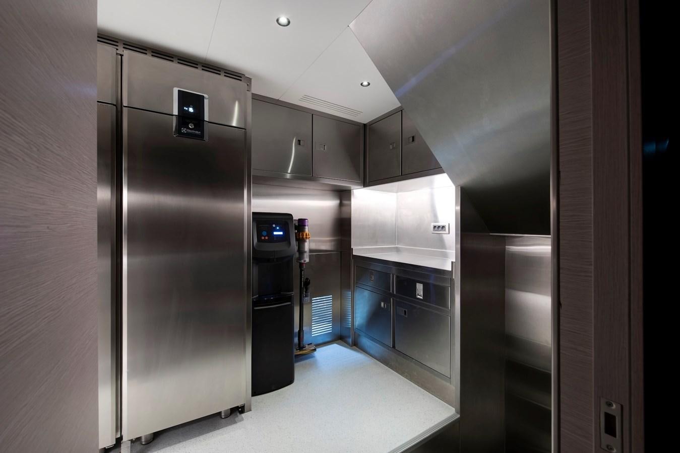 a large kitchen with stainless steel appliances aboard MAZU 82 Yacht for Sale