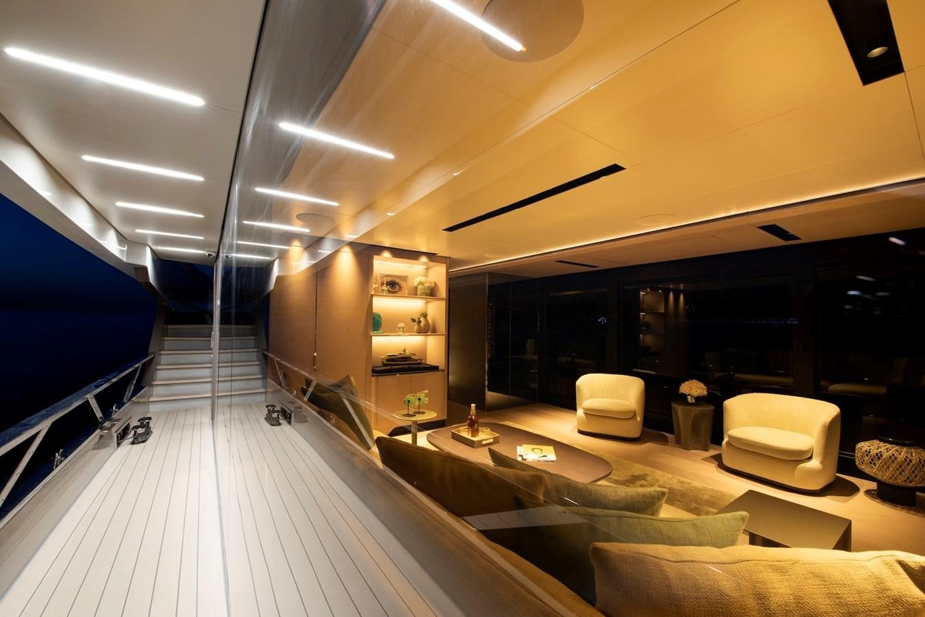 a modern looking living room aboard MAZU 82 Yacht for Sale