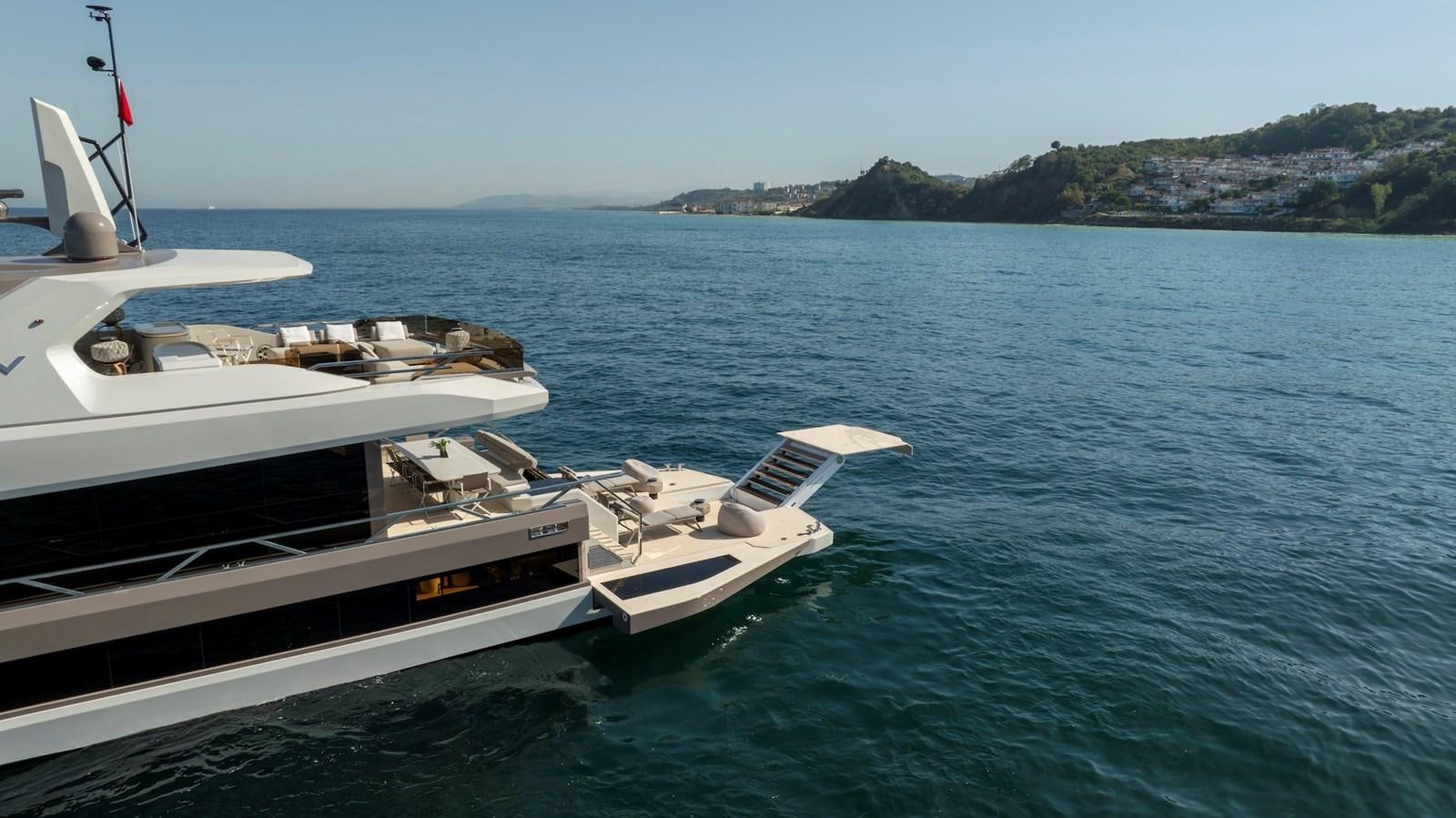 a couple of boats on the water aboard MAZU 82 Yacht for Sale