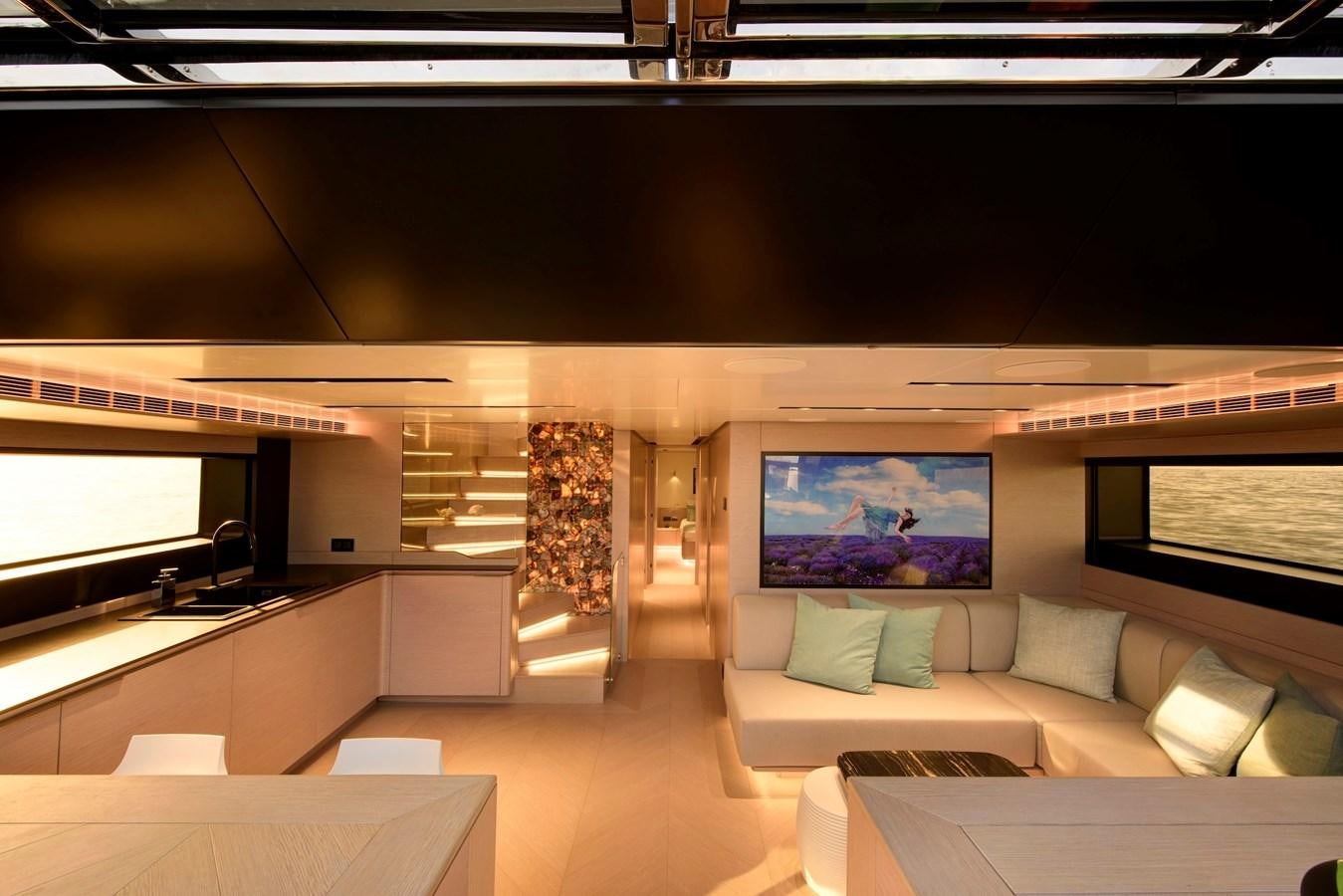 a room with a couch and a tv aboard MAZU 82 Yacht for Sale