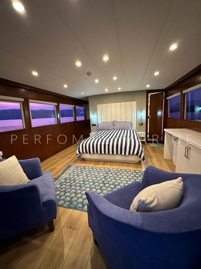 a large bedroom with a large bed aboard M/Y TUZLA 27M Yacht for Sale