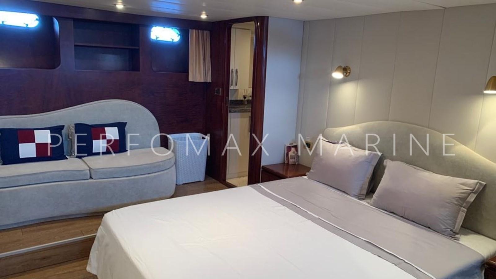 a room with a bed and a couch aboard M/Y TUZLA 27M Yacht for Sale