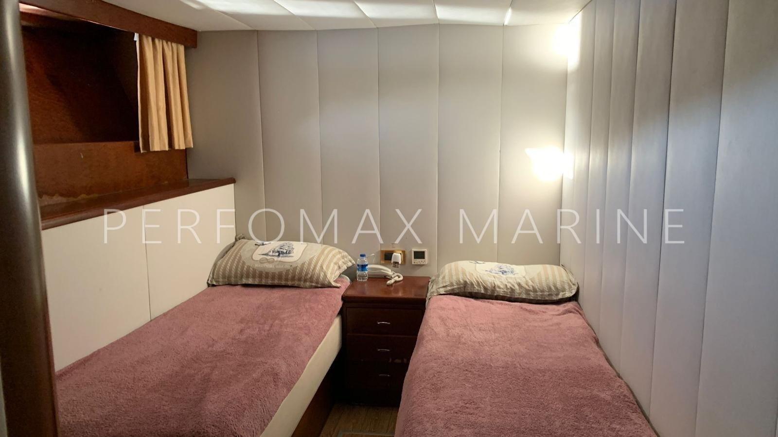 a room with two beds aboard M/Y TUZLA 27M Yacht for Sale