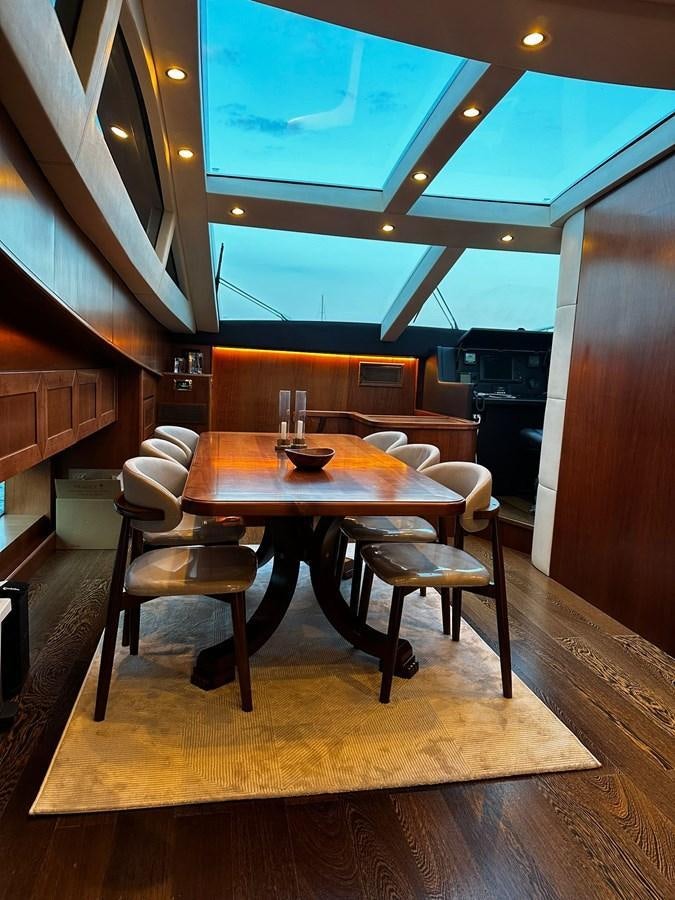 a dining table in a restaurant aboard CONAM 65 FLYBRIDGE Yacht for Sale