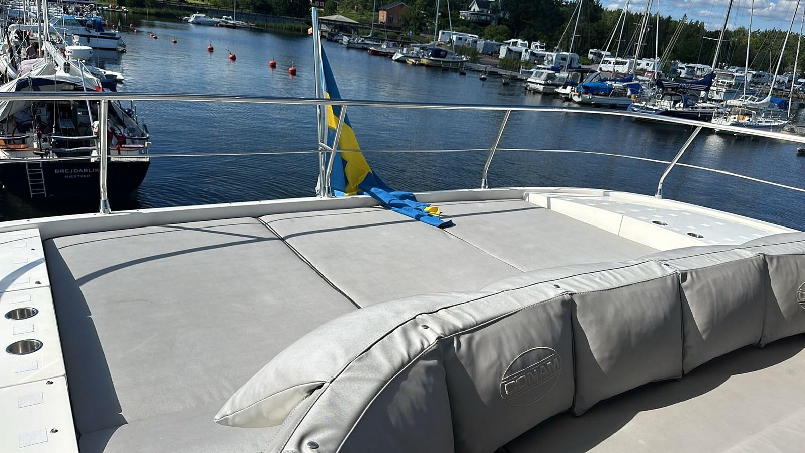 a boat on the water aboard CONAM 65 FLYBRIDGE Yacht for Sale