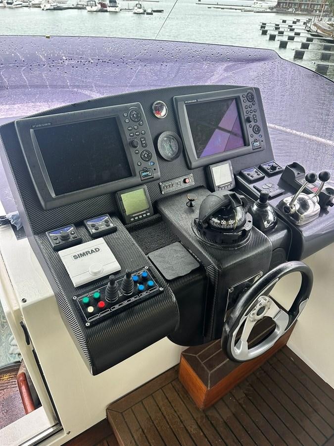 a console with a console and a console aboard CONAM 65 FLYBRIDGE Yacht for Sale