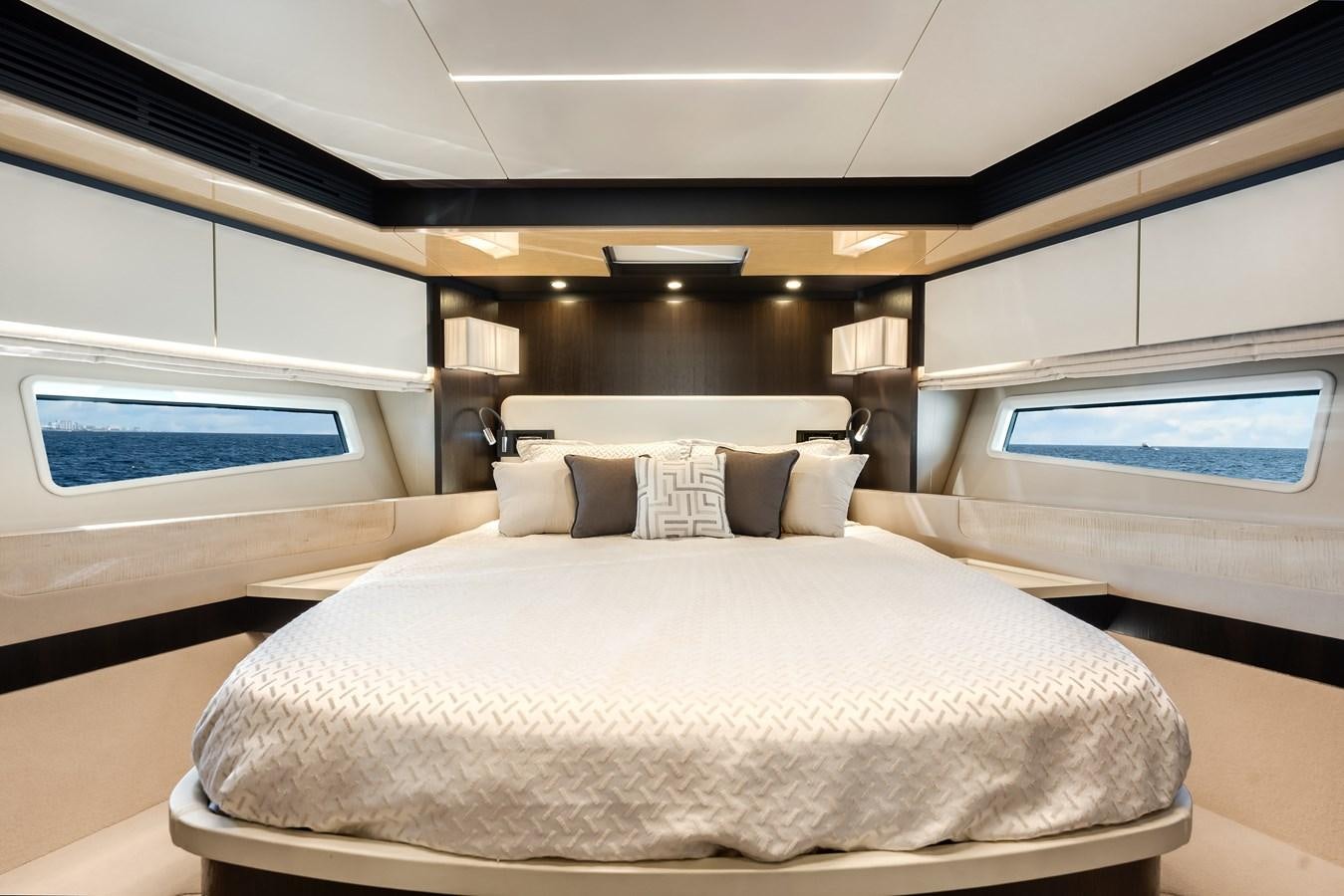 a room with a bed and a window aboard TRUTH SERUM Yacht for Sale