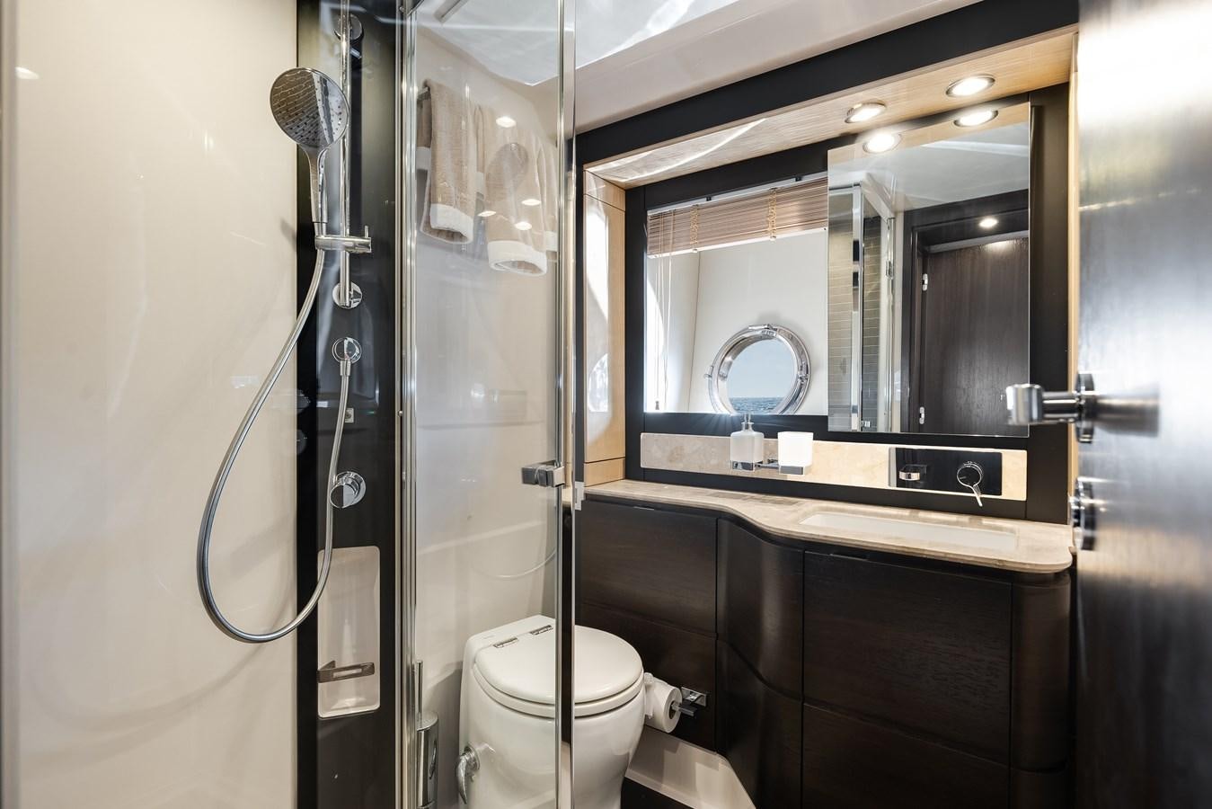 a bathroom with a glass shower aboard TRUTH SERUM Yacht for Sale
