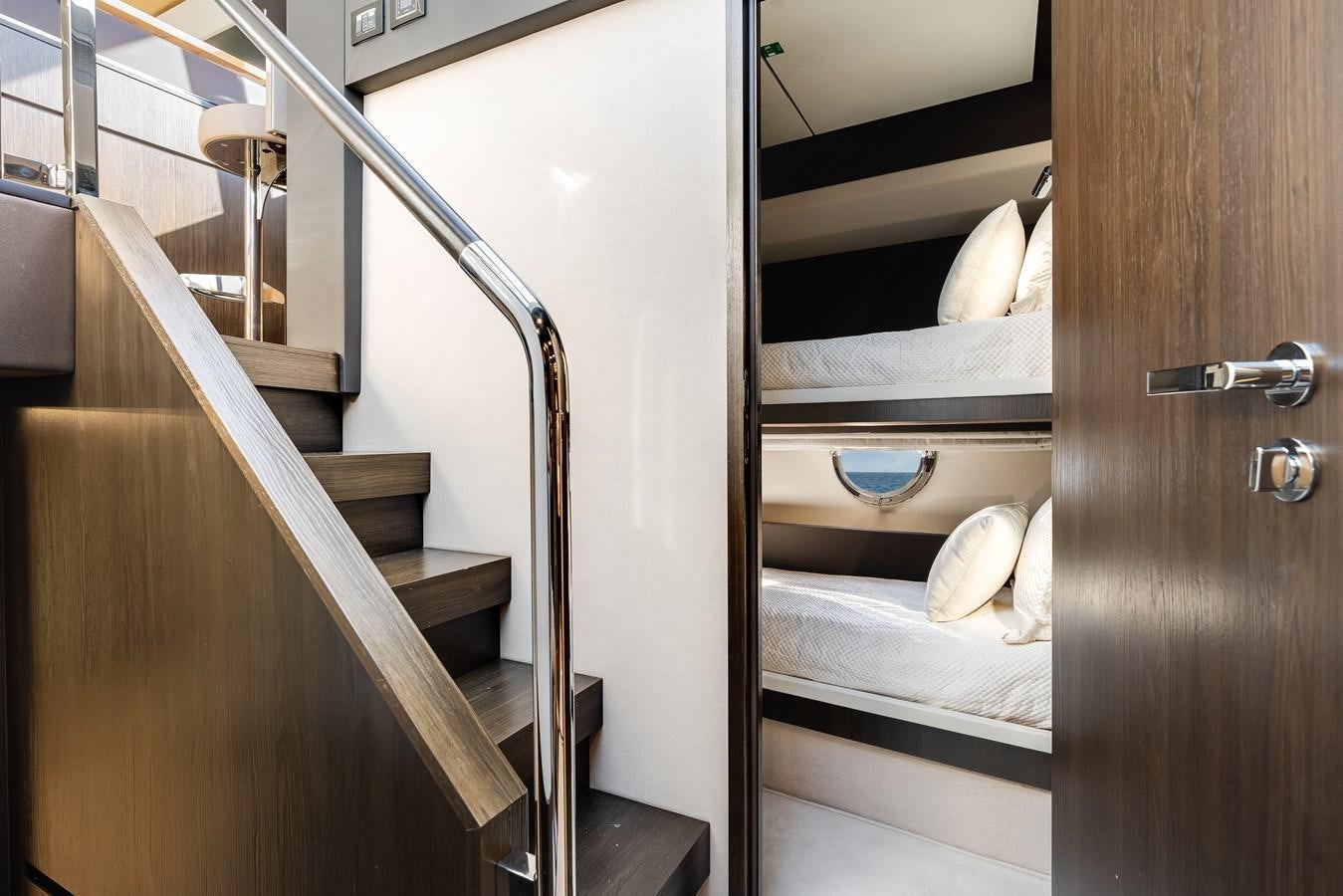 a room with a bed and a door aboard TRUTH SERUM Yacht for Sale
