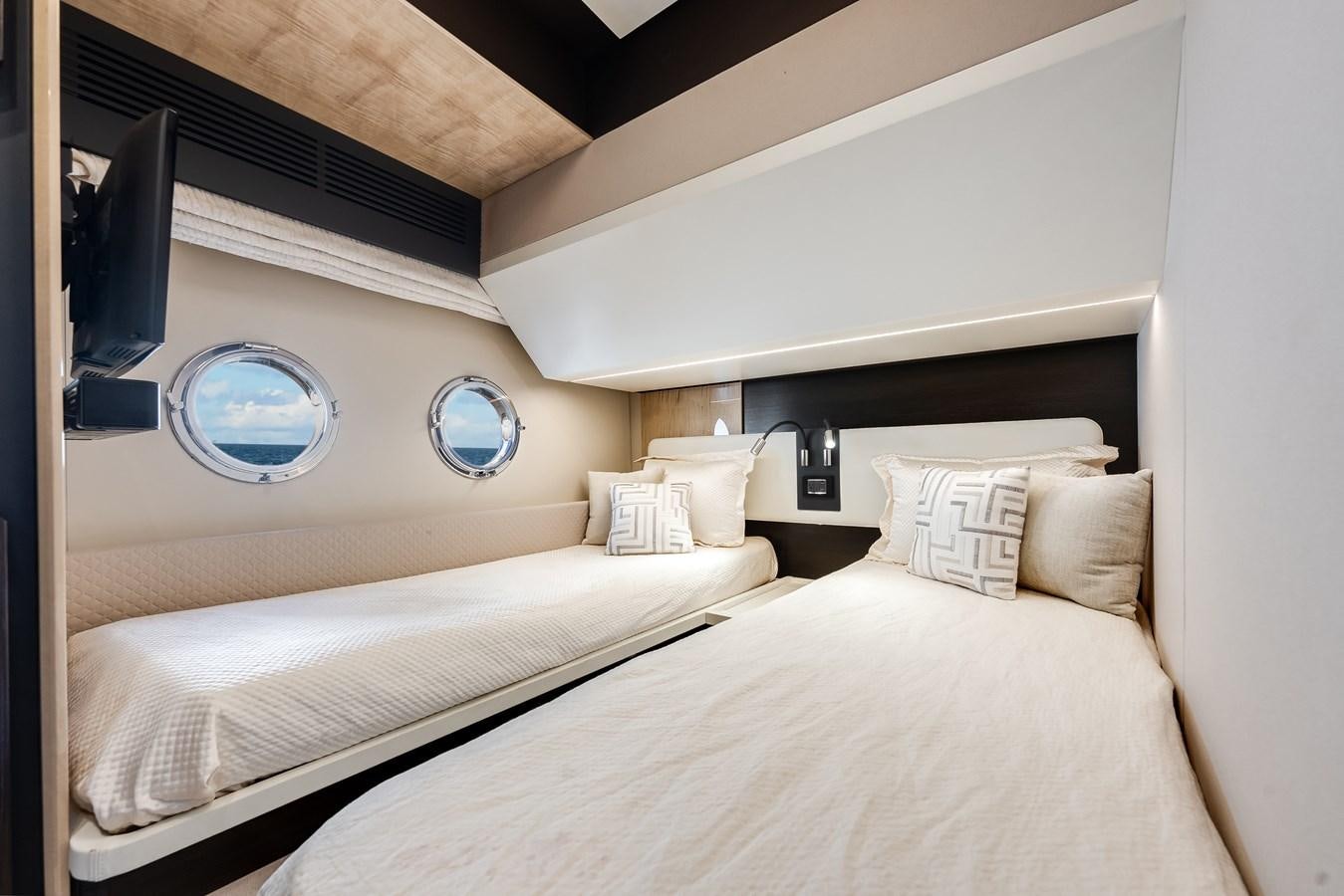 a room with two beds aboard TRUTH SERUM Yacht for Sale