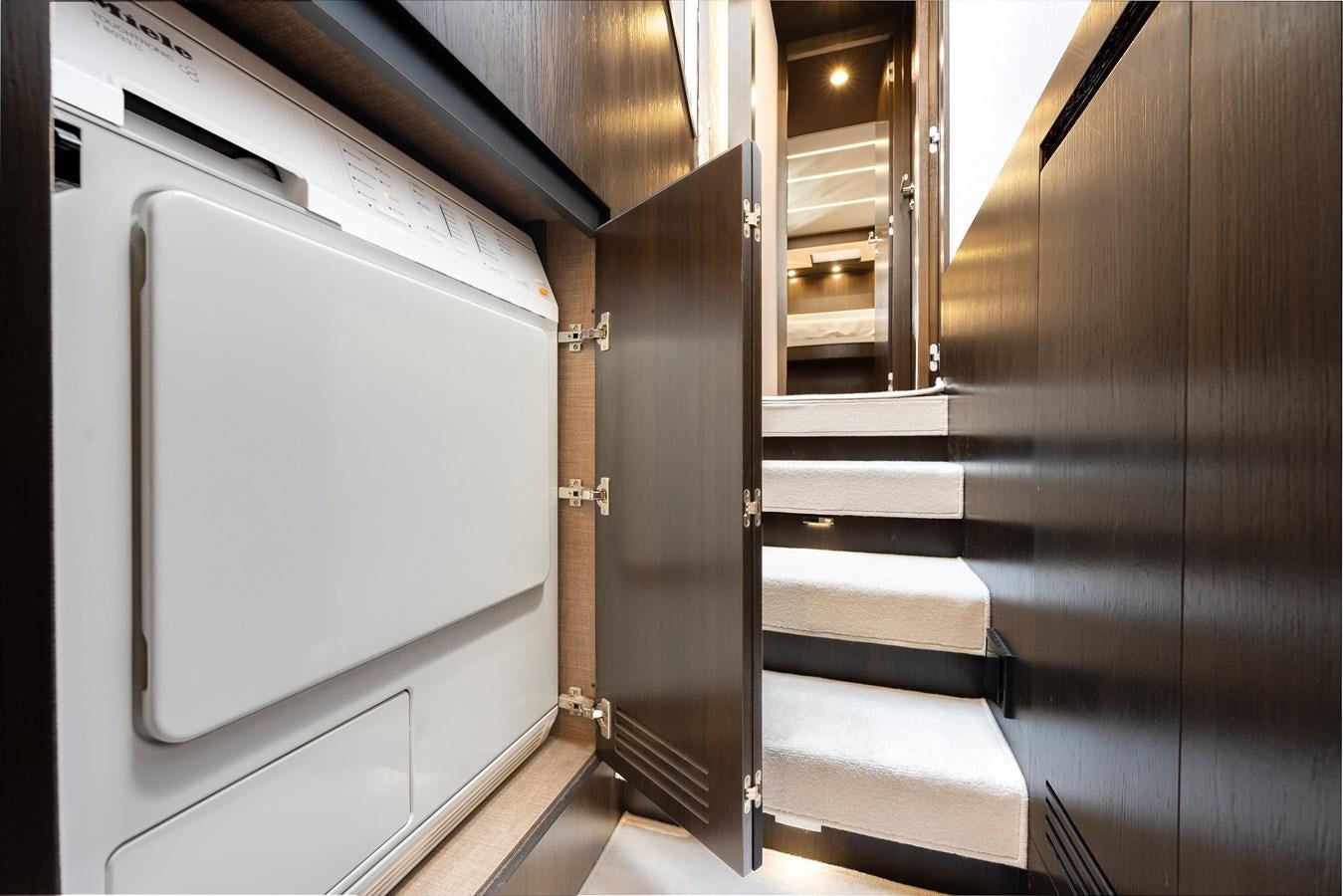a room with a door and a staircase aboard TRUTH SERUM Yacht for Sale